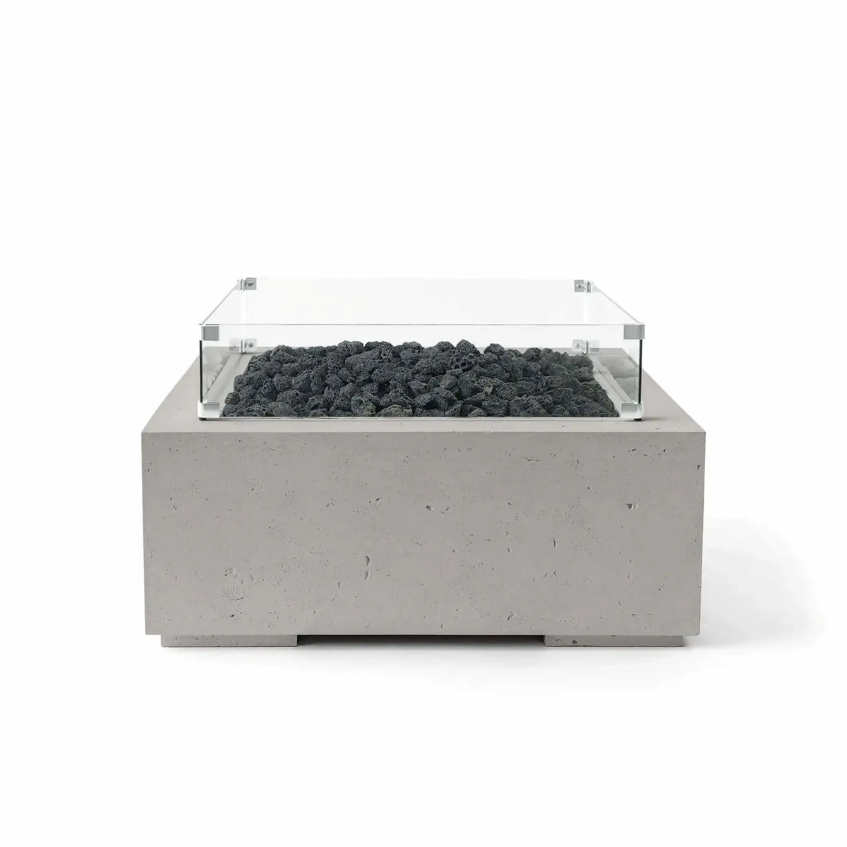 Front view of the HPC Fire Hearth Products Controls Dekko GFRC Concrete Alea 32 x 32 Fire Pit in Sandstone finish with black lava rock media and a tempered glass wind guard. The square GFRC concrete fire feature combines warm neutral tones, contemporary design, and rugged lava rock accents, shown in a professional white-background product photograph.
