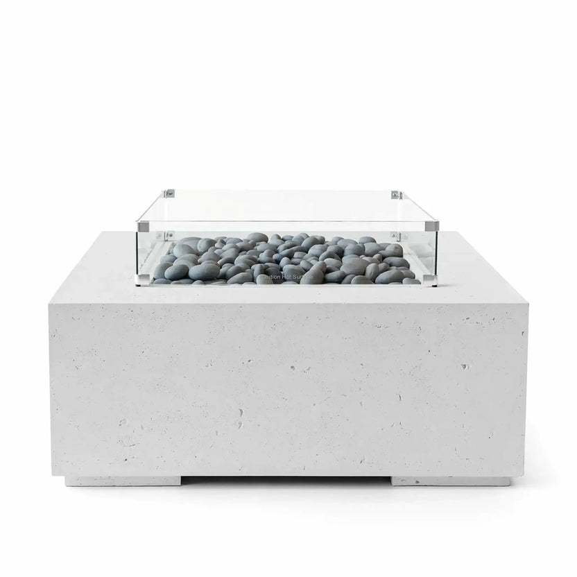 HPC Fire Hearth Products Controls Dekko GFRC Concrete Alea 40 x 40 Fire Pit finished in Ash with decorative slate stones arranged inside the burner area. The contemporary outdoor fire pit includes a tempered glass wind guard and durable GFRC concrete construction with a light gray textured surface. Front-facing product image emphasizing the modern square design and premium fire media presentation.