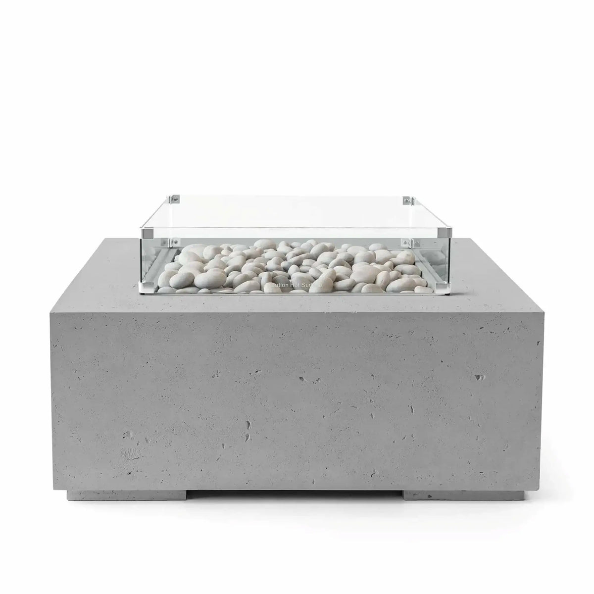 HPC Fire Hearth Products Controls Dekko GFRC Concrete Alea 40 x 40 Fire Pit in Charcoal finish featuring smooth ivory fire stones beneath a clear tempered glass wind guard. The square outdoor fire table showcases a darker concrete body with subtle texture, creating a striking contrast against the white stone media. Professional studio image highlighting the modern architectural design.