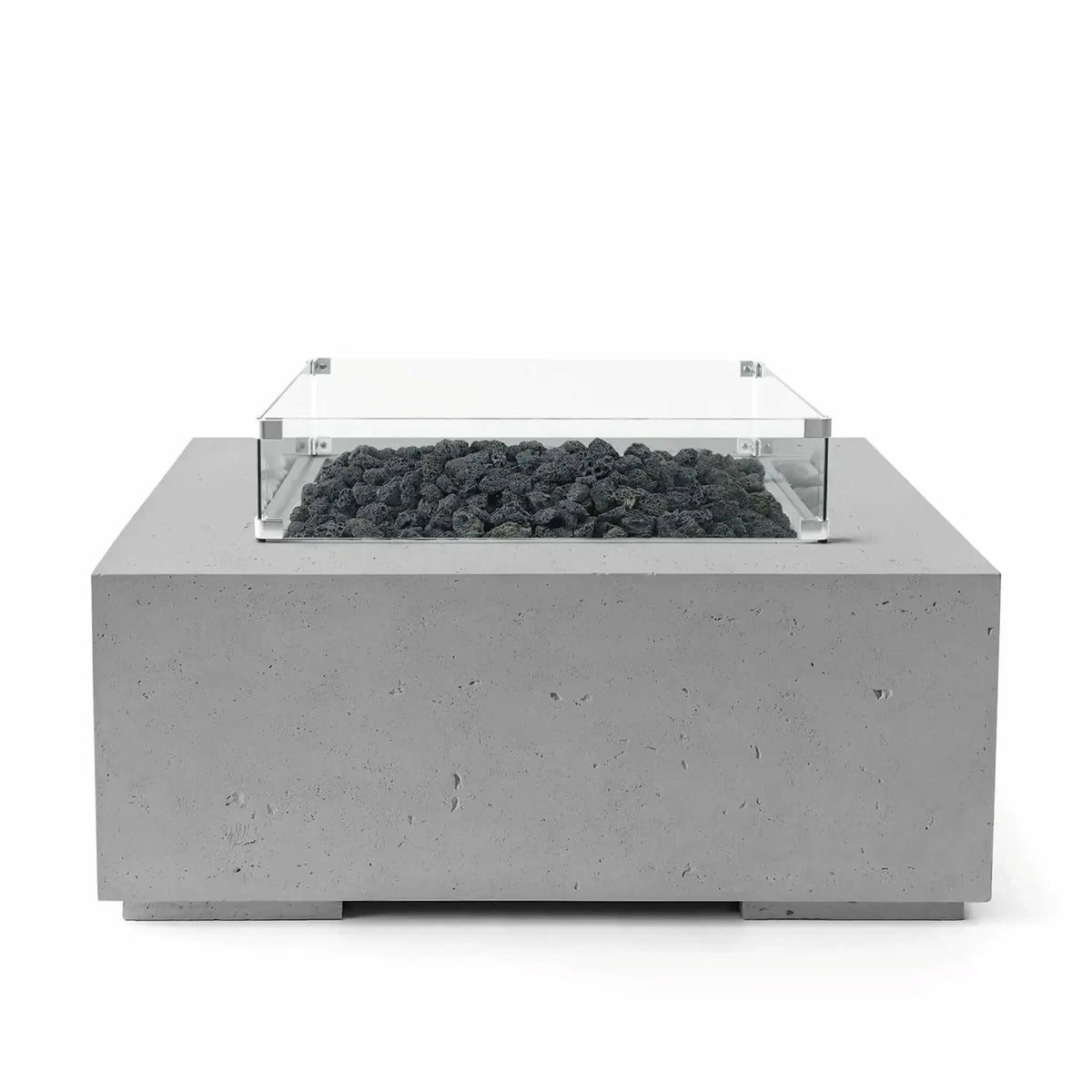 HPC Fire Hearth Products Controls Dekko GFRC Concrete Alea 40 x 40 Fire Pit with Charcoal concrete finish and black lava rock burner media. The square GFRC concrete fire pit is topped with a clear tempered glass wind guard that frames the burner area while maintaining a clean, contemporary appearance. Product image showcasing modern outdoor living and durable fire feature construction.