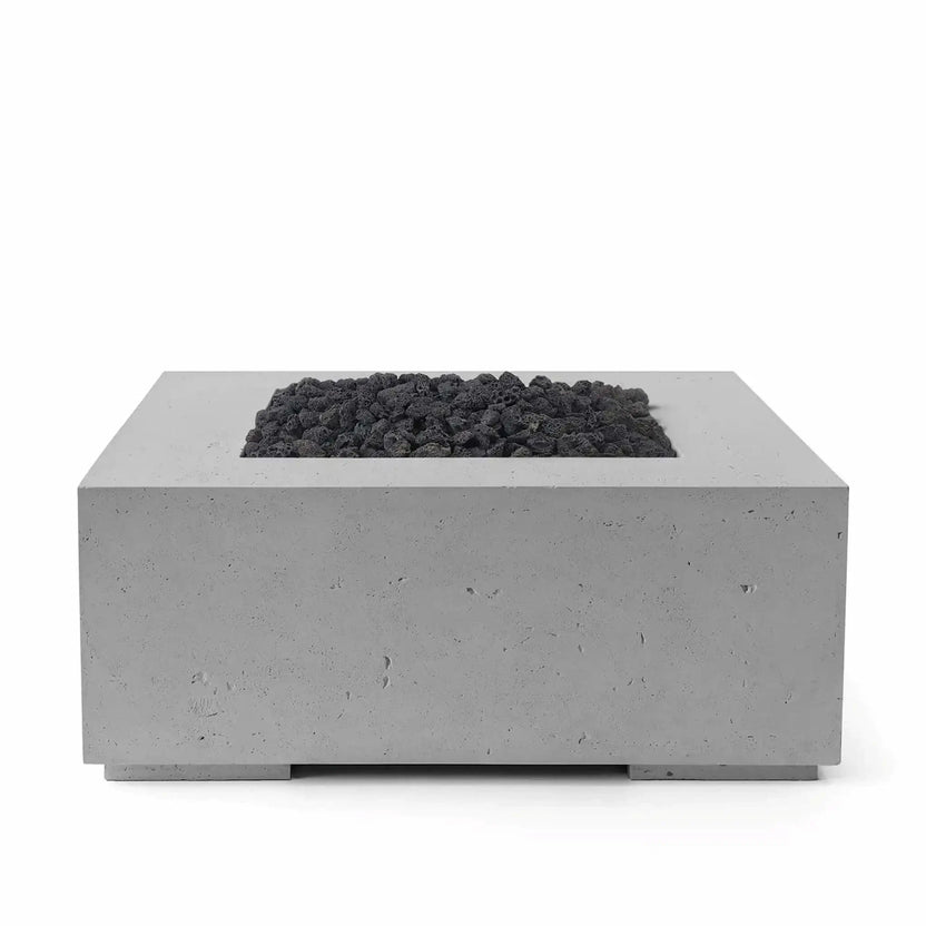 HPC Fire Hearth Products Controls Dekko GFRC Concrete Alea 40 x 40 Fire Pit in Charcoal finish featuring black lava rock media. The square GFRC concrete fire pit has a clean modern design with a recessed burner tray filled with rugged volcanic rock. Its dark charcoal finish, minimalist styling, and durable outdoor construction make it a bold focal point for patios, courtyards, and outdoor gathering spaces.