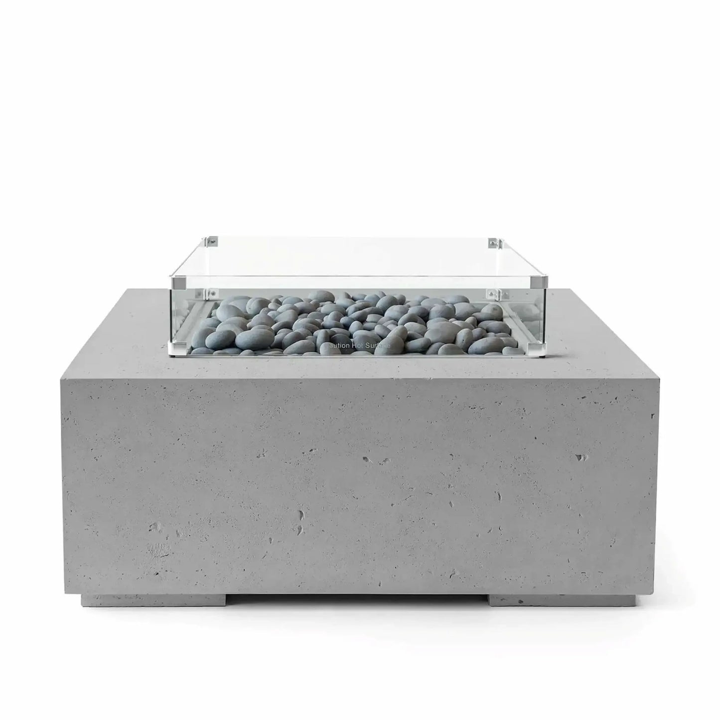 HPC Fire Hearth Products Controls Dekko GFRC Concrete Alea 40 x 40 Fire Pit in Charcoal finish with polished slate stones filling the burner tray. A clear tempered glass wind guard surrounds the burner, complementing the dark gray concrete body and contemporary square silhouette. Front-facing studio image highlighting the premium materials and sophisticated outdoor fire pit design.