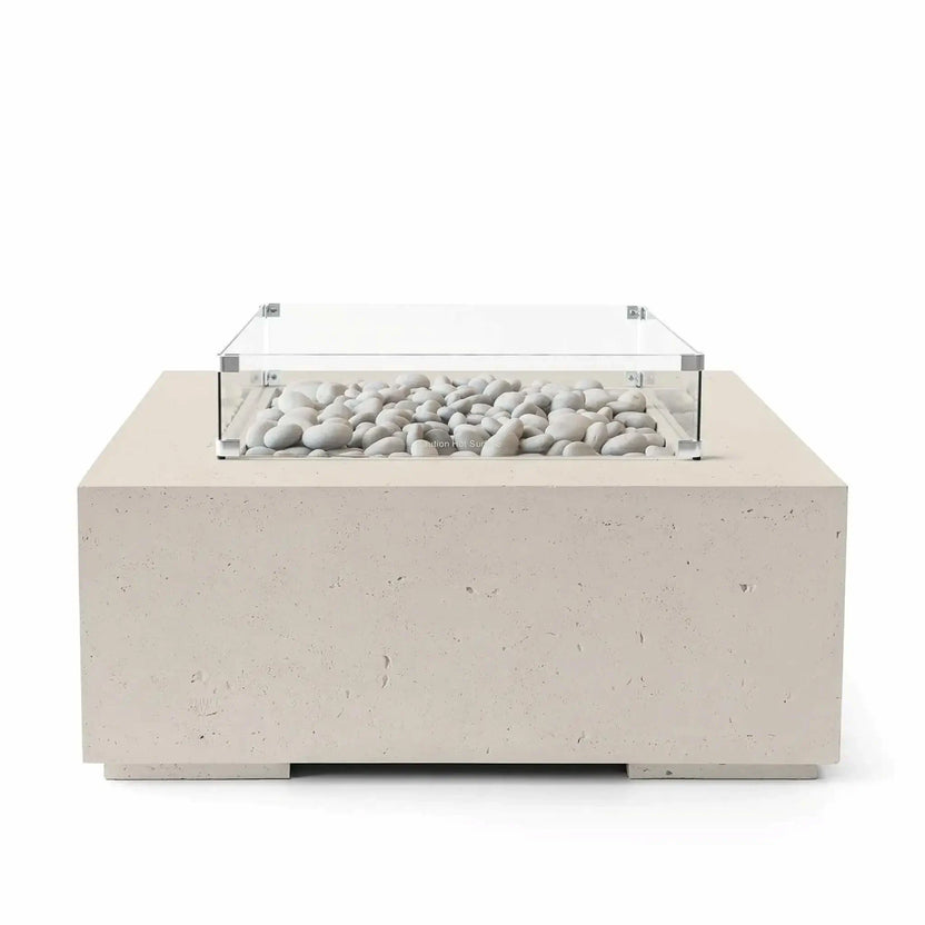 HPC Fire Hearth Products Controls Dekko GFRC Concrete Alea 40 x 40 Fire Pit in warm Clay finish featuring ivory fire stones inside a recessed burner enclosure. The modern square fire pit is crafted from GFRC concrete and includes a tempered glass wind guard for added protection and visual appeal. Clean product image emphasizing the neutral beige tones and contemporary outdoor style.