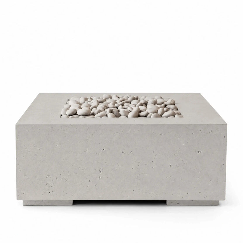 HPC Fire Hearth Products Controls Dekko GFRC Concrete Alea 40 x 40 Fire Pit in Sandstone finish with Ivory Stone media. The product image highlights the warm Sandstone-colored GFRC concrete construction and decorative ivory river stones within the recessed burner area, offering a sophisticated fire pit solution designed to complement residential and commercial outdoor environments.