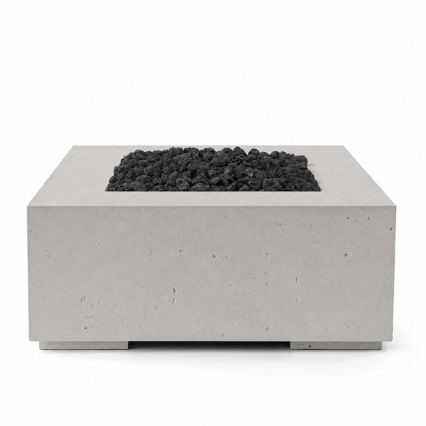 HPC Fire Hearth Products Controls Dekko GFRC Concrete Alea 40 x 40 Fire Pit in Sandstone finish with Lava Rock media. Displayed against a neutral background, the square GFRC concrete fire pit features a recessed burner tray filled with black lava rock, showcasing the contrast between the warm Sandstone finish and dark fire media for a bold contemporary outdoor design.