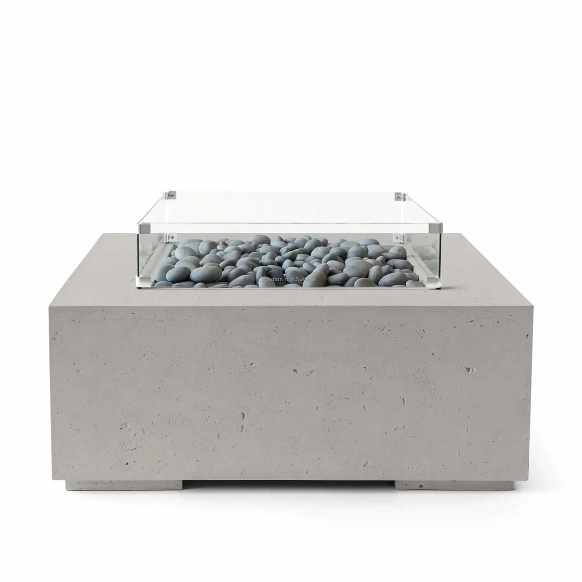 HPC Fire Hearth Products Controls Dekko GFRC Concrete Alea 40 x 40 Fire Pit in Sandstone finish featuring smooth slate stone media beneath a tempered glass wind guard. The warm-toned square GFRC concrete fire pit offers a clean, minimalist appearance with subtle texture and durable construction. Front-facing product image designed to showcase the decorative stone media and premium outdoor fire feature styling.