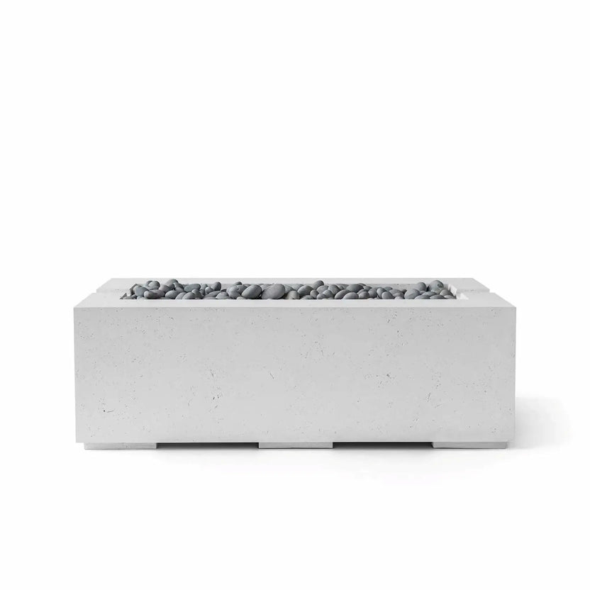 HPC Fire & Hearth Products Controls Dekko GFRC Concrete Avera 48 x 26 Fire Pit in Ash finish with Slate Stone fire media. This sleek rectangular outdoor fire feature combines durable GFRC concrete construction with a recessed linear burner tray filled with smooth gray slate stones. The minimalist design and neutral color palette make the Avera fire pit a stylish centerpiece for modern patios, decks, and outdoor gathering spaces.