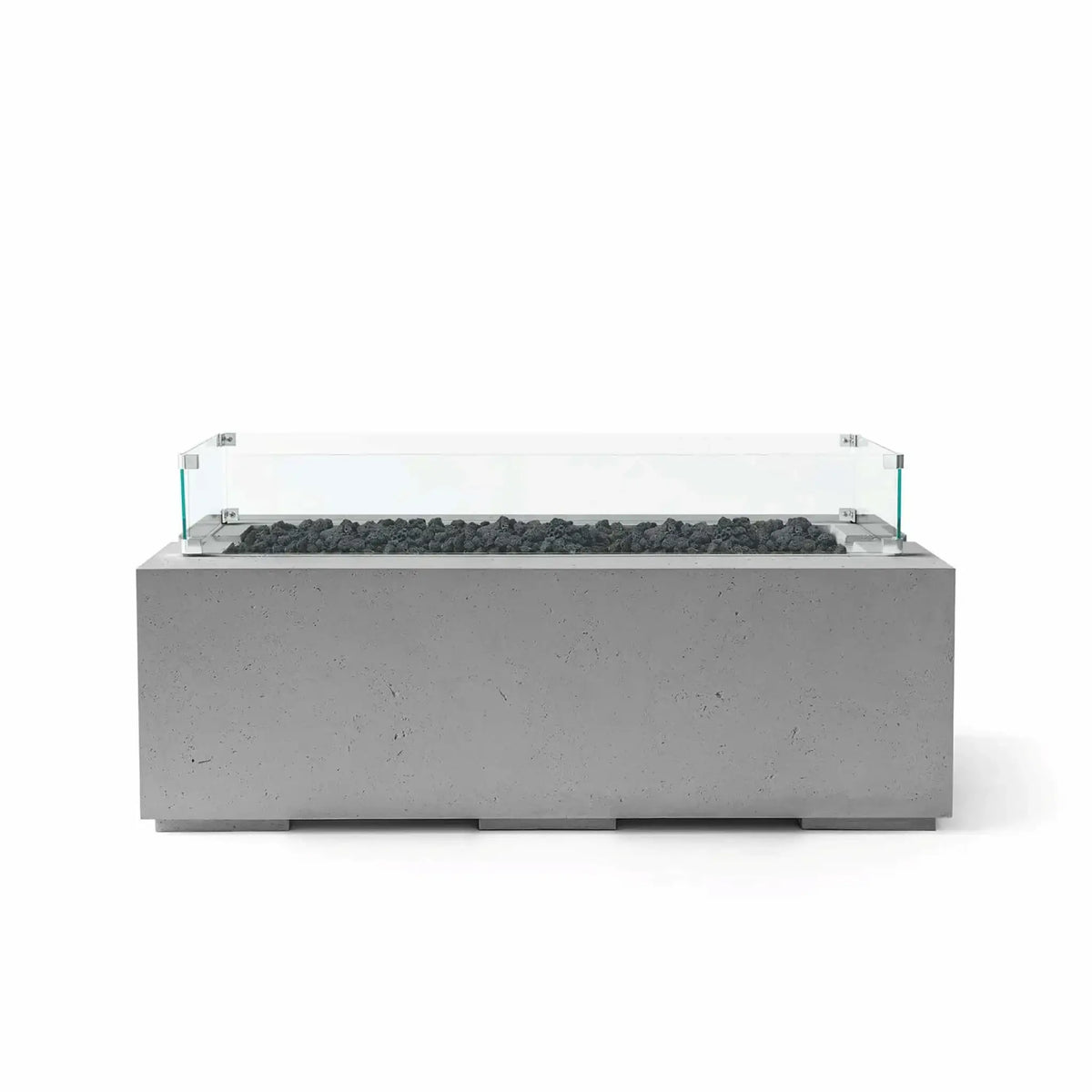 HPC Fire & Hearth Products Dekko GFRC Concrete Avera 48 x 26 Fire Pit Charcoal Lava Rock Tempered Glass Wind Guard featuring dark lava rock media and a contemporary charcoal GFRC concrete body. The sleek linear fire pit includes a clear glass wind guard mounted around the burner area, delivering a modern outdoor centerpiece designed for patios, lounges, and luxury backyard gathering spaces.
