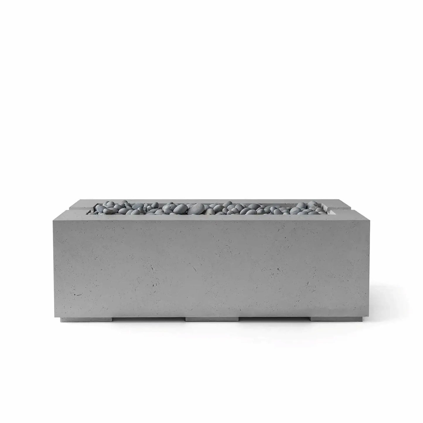 HPC Fire & Hearth Products Controls Dekko GFRC Concrete Avera 48 x 26 Fire Pit in Charcoal finish with smooth Slate Stone media. The rectangular fire pit showcases a clean-lined GFRC concrete exterior and a recessed linear burner channel filled with gray decorative stones. This sophisticated outdoor fire feature blends modern styling with durable construction, creating an attractive focal point for patios, terraces, and outdoor lounge areas.