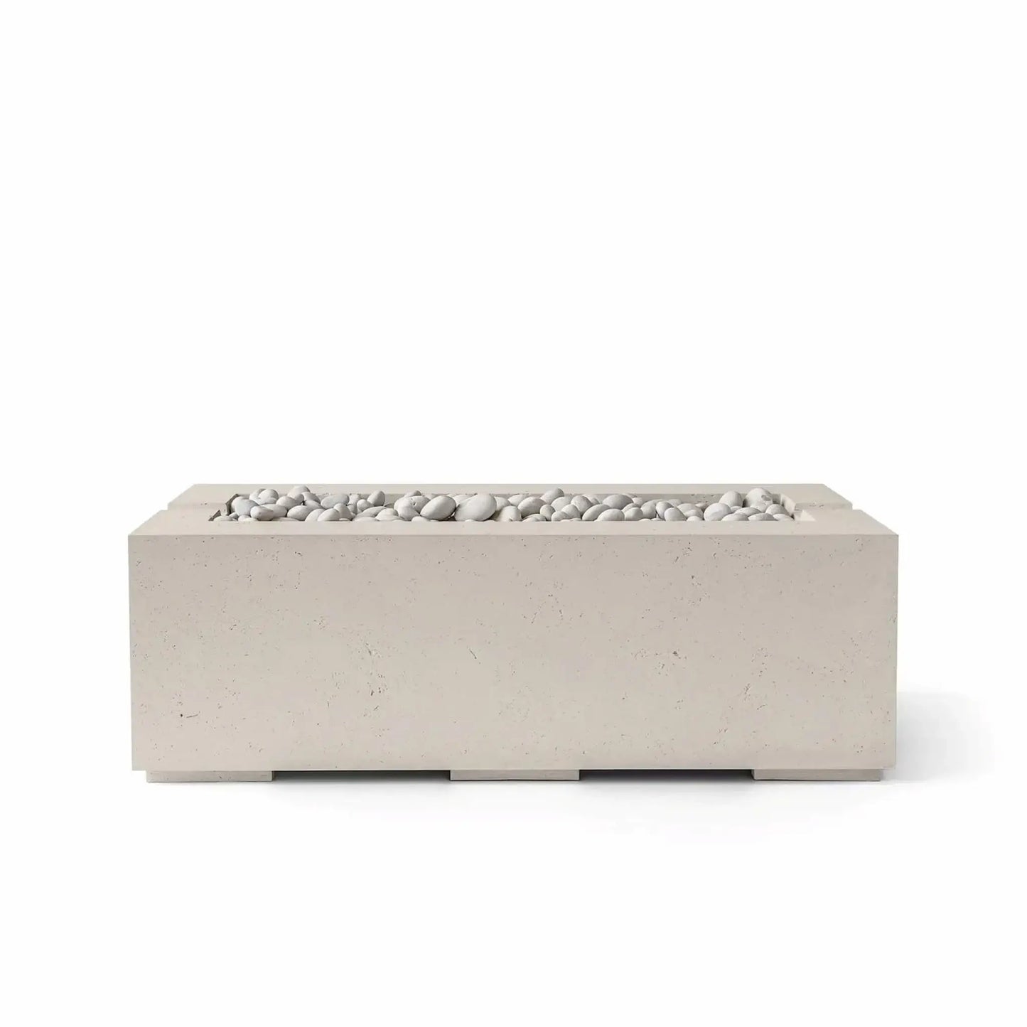 HPC Fire & Hearth Products Controls Dekko GFRC Concrete Avera 48 x 26 Fire Pit in Clay finish featuring Ivory Stone fire media. The warm beige concrete finish complements the smooth white stones positioned within the linear burner tray, creating a refined and inviting outdoor centerpiece. This contemporary GFRC concrete Avera fire pit is designed for residential patios, backyard retreats, and luxury outdoor living spaces.