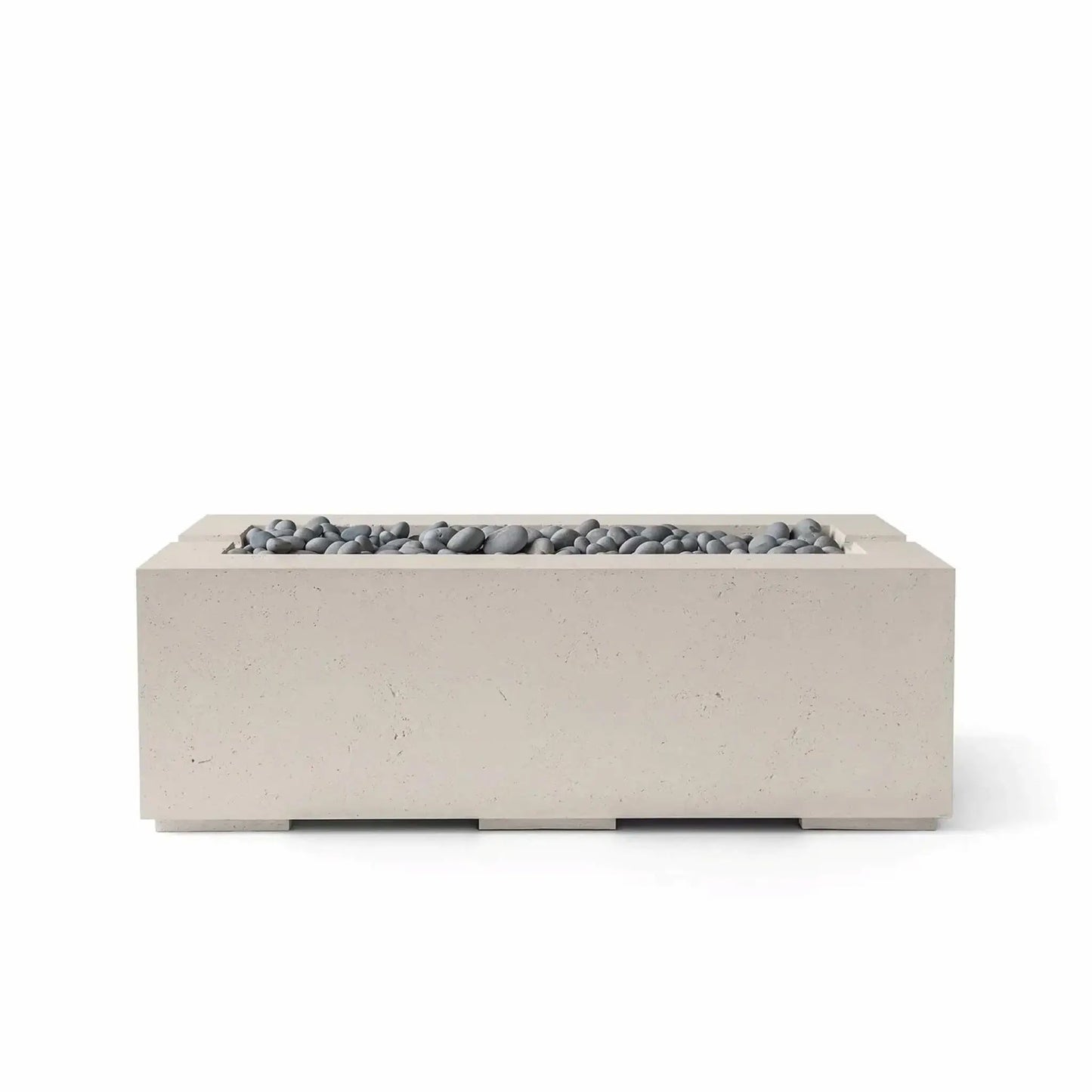 HPC Fire & Hearth Products Controls Dekko GFRC Concrete Avera 48 x 26 Fire Pit in Clay finish with Slate Stone media. The modern rectangular fire pit combines a warm-toned GFRC concrete exterior with smooth gray decorative stones arranged within the linear burner tray. Its clean geometric profile and premium materials make the Avera fire pit an elegant addition to patios, poolside lounges, and contemporary outdoor living environments.