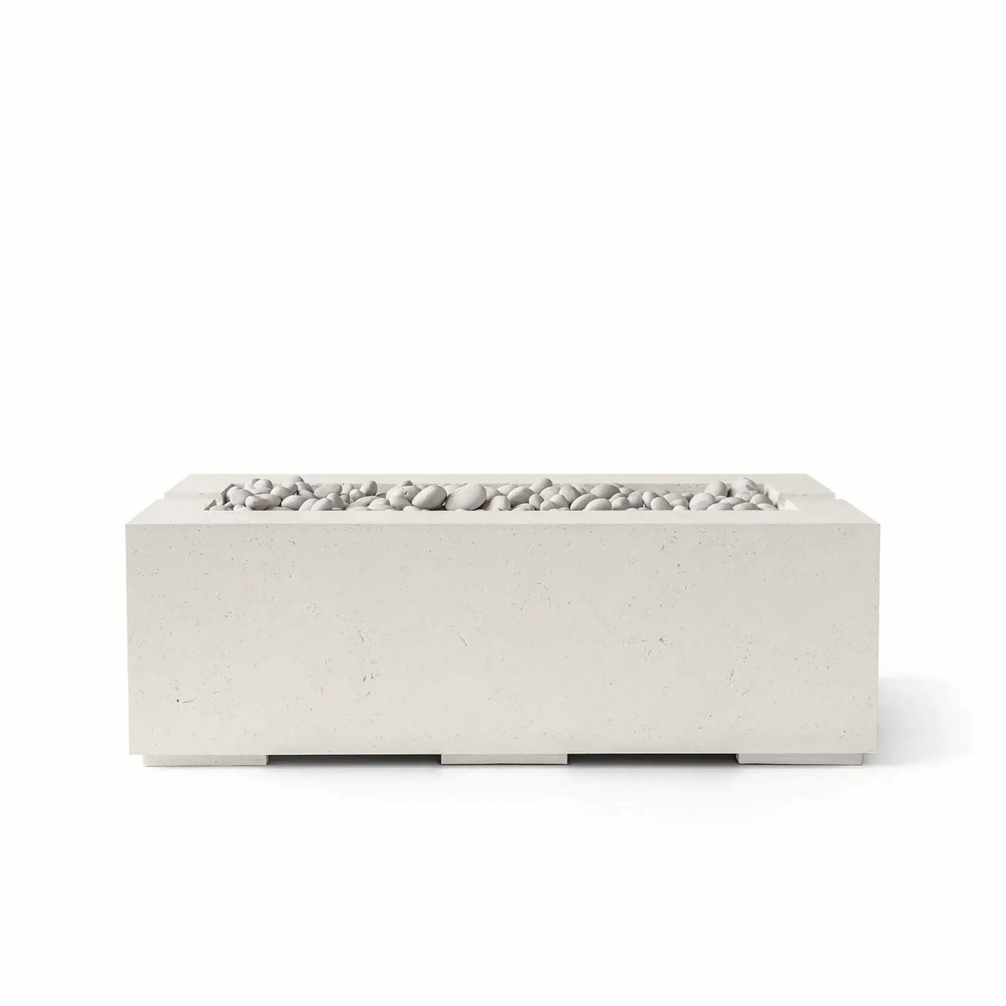 HPC Fire & Hearth Products Controls Dekko GFRC Concrete Avera 48 x 26 Fire Pit in Limestone finish featuring Ivory Stone media. The rectangular GFRC concrete fire pit showcases a soft cream-colored exterior paired with smooth white decorative stones arranged within the recessed linear burner tray. Displayed on a white background, the Avera fire pit offers a clean, contemporary aesthetic suited for patios, poolside lounges, and luxury outdoor living spaces.