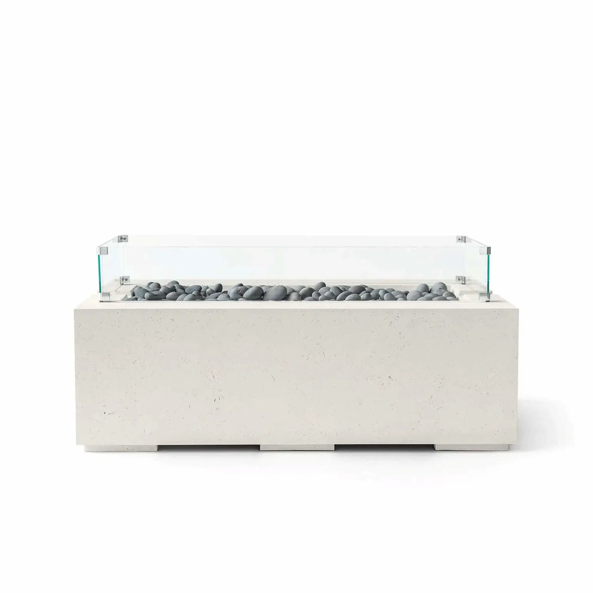 HPC Fire & Hearth Products Dekko GFRC Concrete Avera 48 x 26 Fire Pit Limestone Slate Stone Tempered Glass Wind Guard model shown with smooth gray slate stone media inside a linear burner channel. The limestone-colored GFRC concrete fire table features a low-profile rectangular design and a clear tempered glass wind guard that enhances safety, flame protection, and modern outdoor aesthetics.