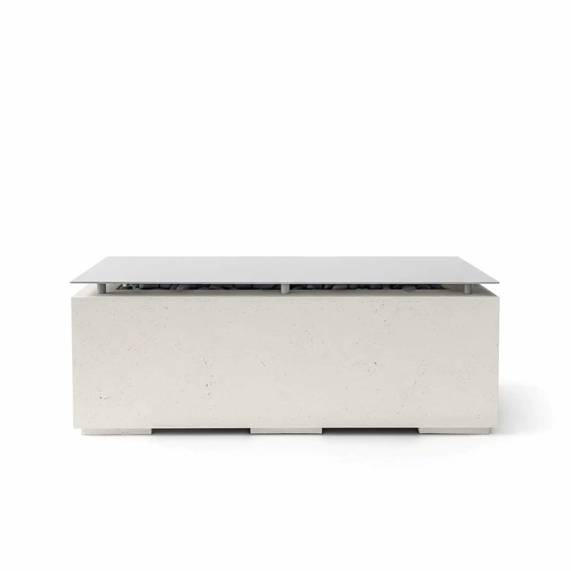 HPC Fire & Hearth Products Dekko GFRC Concrete Avera 48 x 26 Fire Pit Limestone Table Top Lid shown in a soft limestone finish. The rectangular fire pit table features a textured GFRC concrete body, elevated metal lid, and minimalist outdoor design. The tabletop cover conceals the fire pit opening and media beneath, allowing the Avera fire feature to double as a stylish outdoor coffee table for patios and entertaining spaces.