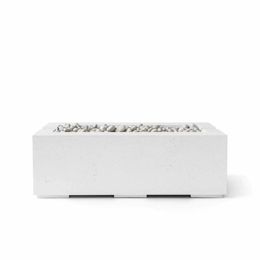HPC Fire & Hearth Products Controls Dekko GFRC Concrete Avera 48 x 26 Fire Pit in Natural finish with Ivory Stone media. The rectangular fire pit features a light gray natural concrete appearance accented by smooth white decorative stones filling the recessed linear burner tray. Shown in a studio-style product image against a white background, the Avera fire pit combines modern architectural styling with premium GFRC concrete construction for upscale residential and commercial outdoor spaces.