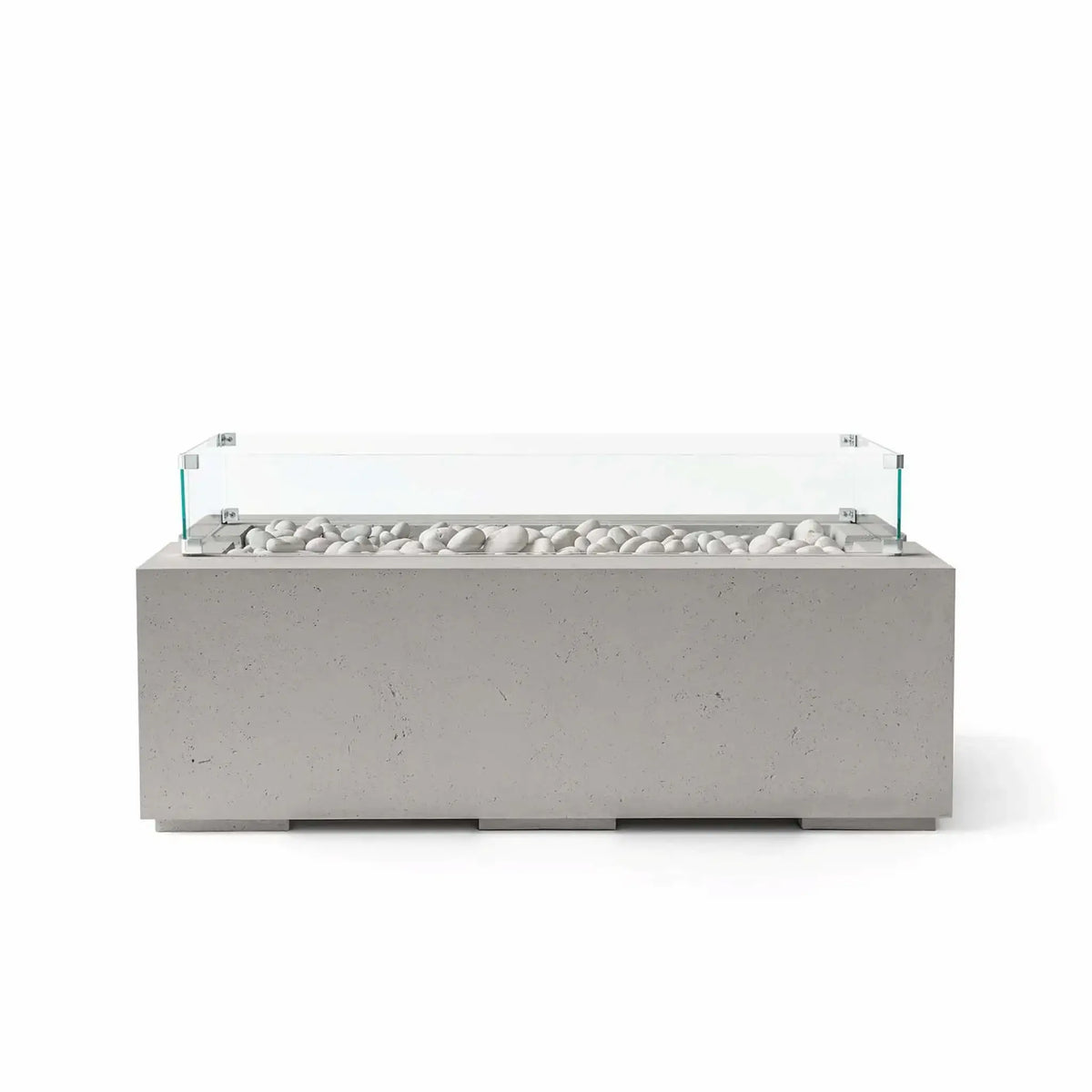 HPC Fire & Hearth Products Dekko GFRC Concrete Avera 48 x 26 Fire Pit Sandstone Ivory Stone Tempered Glass Wind Guard displayed with a warm sandstone concrete finish and decorative ivory stone media. This contemporary rectangular fire pit table features a linear burner configuration and clear tempered glass wind guard, offering a clean, upscale appearance while helping shield flames from outdoor breezes.
