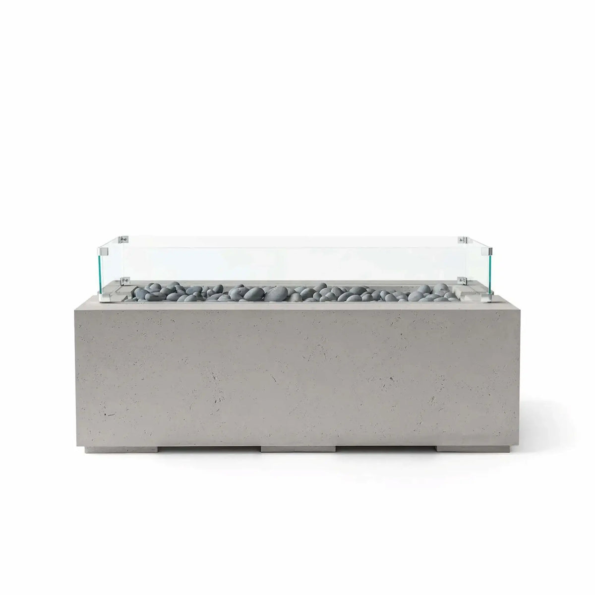 HPC Fire & Hearth Products Dekko GFRC Concrete Avera 48 x 26 Fire Pit Sandstone Slate Stone Tempered Glass Wind Guard shown with polished gray slate stones and a clear tempered glass enclosure around the burner area. The textured sandstone GFRC concrete body and elongated rectangular shape create a sophisticated outdoor fire feature ideal for luxury patios, rooftop terraces, and contemporary landscape projects.