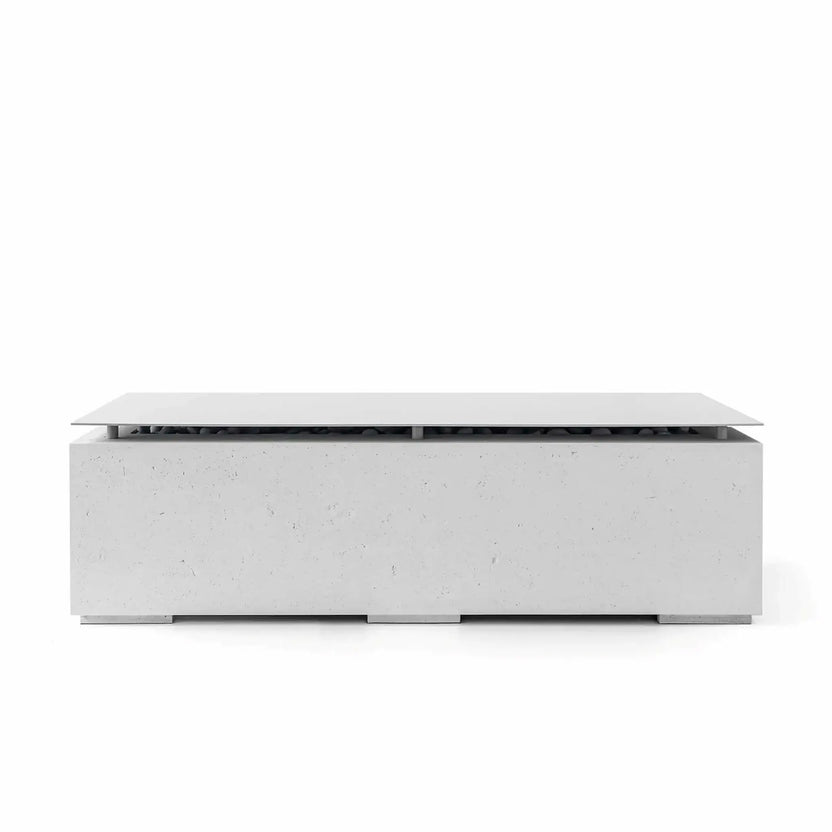Front-facing product image of the HPC Fire Hearth Products Controls Dekko GFRC Concrete Avera 60 x 26 Fire Pit in the Ash finish, shown with the matching stainless steel table top lid installed. The rectangular fire pit features a smooth light gray GFRC concrete base, low-profile modern design, hidden fire media beneath the lid, and clean architectural styling on a white background.