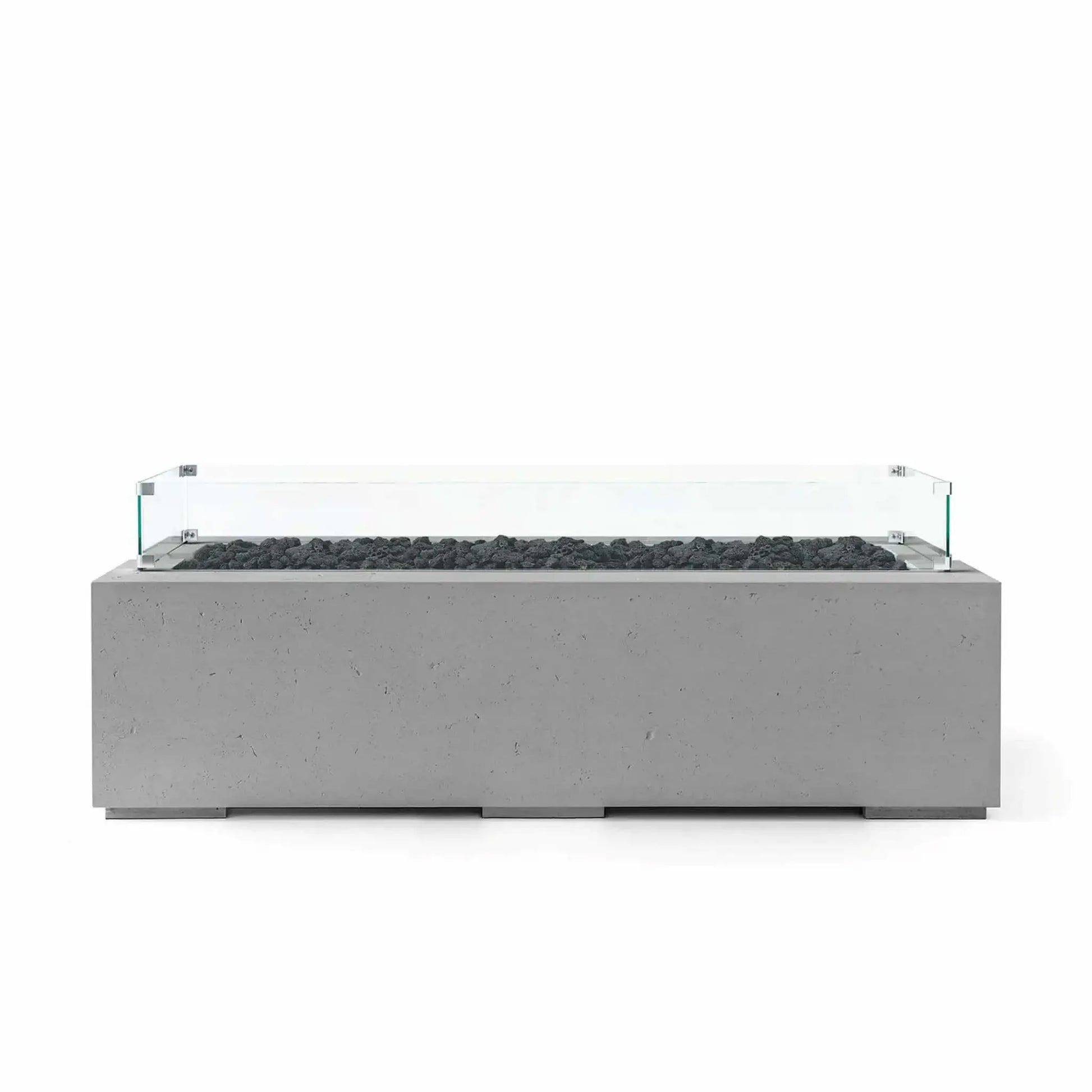 HPC Fire Hearth Products Controls Dekko GFRC Concrete Avera 60 x 26 Fire Pit featuring a Charcoal finish, black lava rock media, and a clear tempered glass wind guard. The sleek rectangular fire pit combines textured GFRC concrete construction with a modern linear burner layout, creating a sophisticated outdoor centerpiece suitable for patios, terraces, and luxury backyard entertainment spaces.
