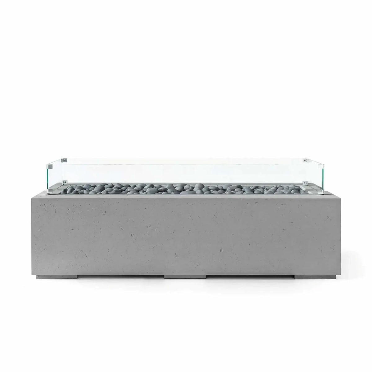 HPC Fire Hearth Products Controls Dekko GFRC Concrete Avera 60 x 26 Fire Pit in Charcoal finish with decorative slate stone media and a tempered glass wind guard. This contemporary rectangular outdoor fire pit features durable GFRC concrete construction, a long linear burner channel, and clean architectural styling designed for modern patios, outdoor seating areas, and upscale landscape projects.