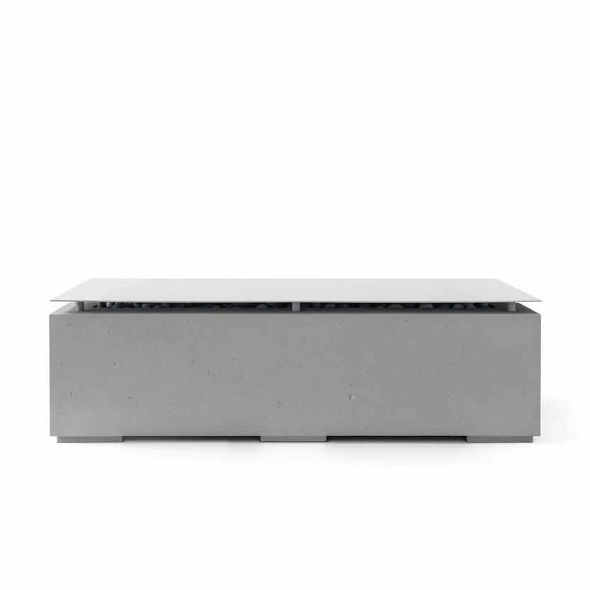 Front view of the HPC Fire Hearth Products Controls Dekko GFRC Concrete Avera 60 x 26 Fire Pit finished in Charcoal gray with a coordinating stainless steel table top lid. The contemporary rectangular fire pit showcases a dark concrete texture, sleek geometric lines, concealed burner area, and minimalist outdoor living design against a clean white background.