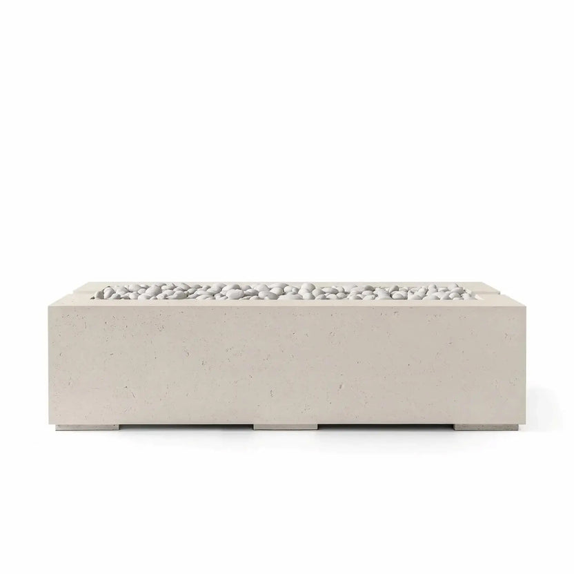 HPC Fire Hearth Products Controls Dekko GFRC Concrete Avera 60 x 26 Fire Pit in a warm Clay finish with Ivory Stone fire media. The rectangular outdoor gas fire pit features clean architectural lines, durable glass fiber reinforced concrete construction, and smooth white decorative stones for a refined, contemporary backyard fire feature.