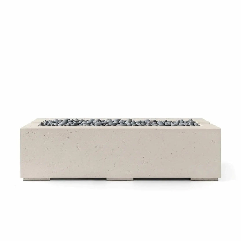 HPC Fire Hearth Products Controls Dekko Avera 60 x 26 GFRC Concrete Fire Pit shown in Clay finish with Slate Stone media. This contemporary rectangular fire pit features a recessed burner tray, textured concrete construction, and smooth gray decorative stones, making it an attractive centerpiece for luxury outdoor living and entertainment areas.