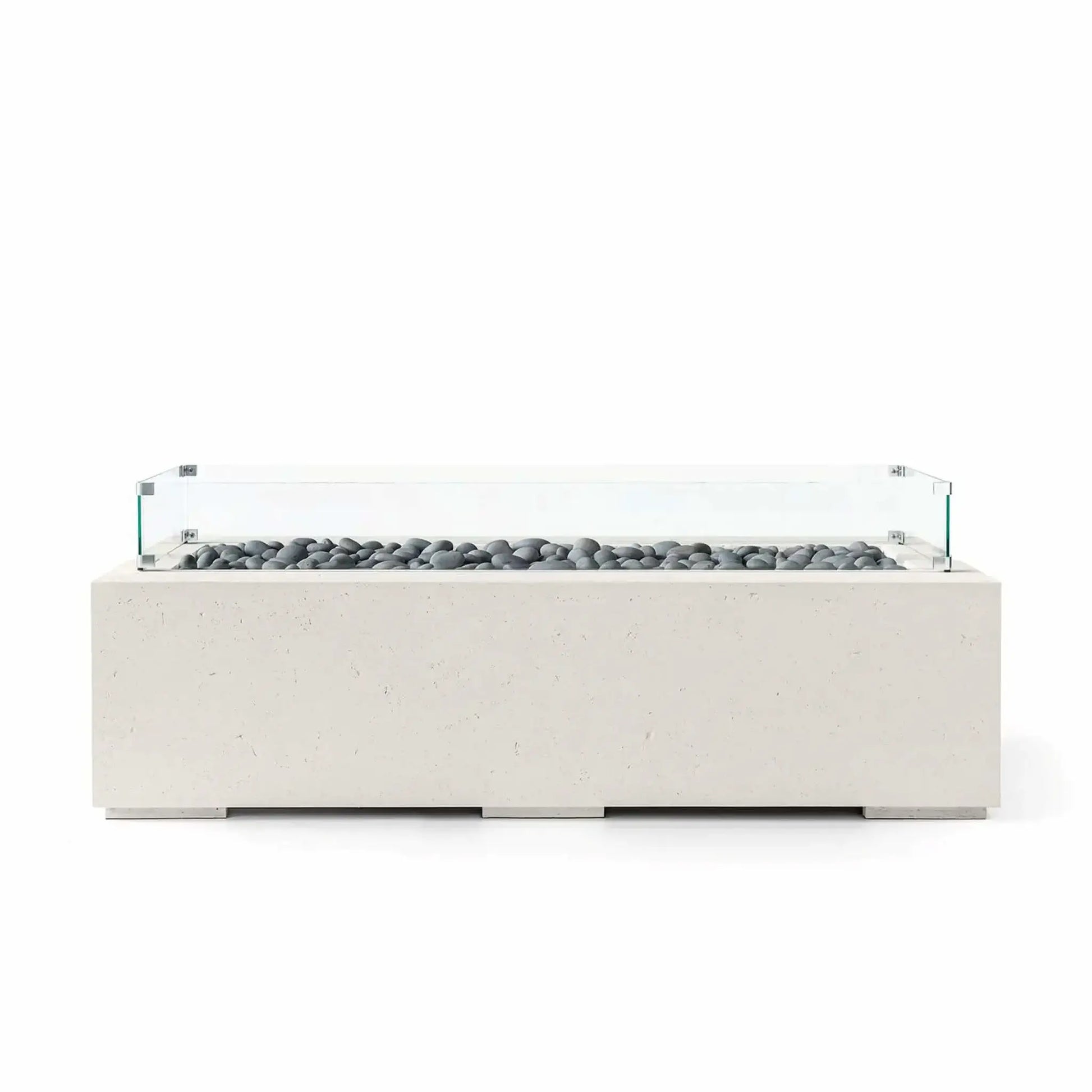HPC Fire Hearth Products Controls Dekko GFRC Concrete Avera 60 x 26 Fire Pit with a Limestone concrete finish, decorative gray slate stones, and a tempered glass wind guard. The sleek rectangular fire pit features a long linear burner enclosure, low-profile base, and modern architectural styling designed to enhance upscale patios, outdoor seating areas, and contemporary landscape designs.