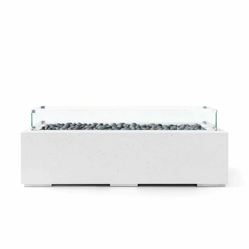 HPC Fire Hearth Products Controls Dekko GFRC Concrete Avera 60 x 26 Fire Pit with a Natural concrete finish, polished slate stone media, and a tempered glass wind guard. The elongated rectangular fire pit features a contemporary linear burner channel, durable GFRC construction, and a refined minimalist appearance suited for residential patios and modern outdoor living environments.
