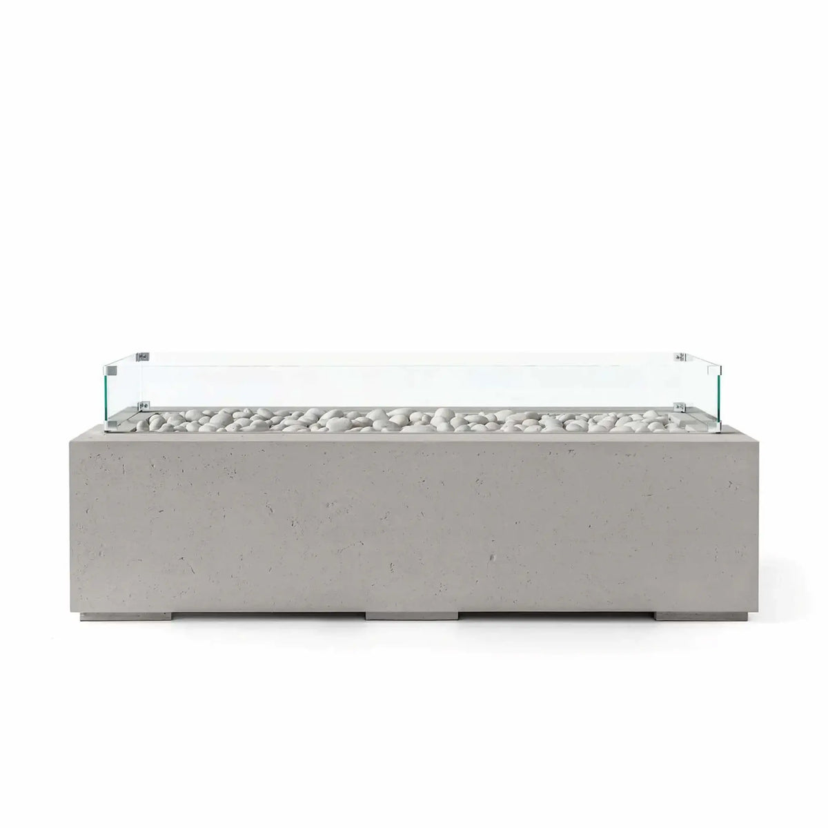 HPC Fire Hearth Products Controls Dekko GFRC Concrete Avera 60 x 26 Fire Pit in Sandstone finish featuring ivory fire stones and a clear tempered glass wind guard. The warm-toned rectangular fire pit offers durable GFRC concrete construction, a sleek linear burner configuration, and clean contemporary styling that complements outdoor seating areas, patios, and luxury landscape designs.