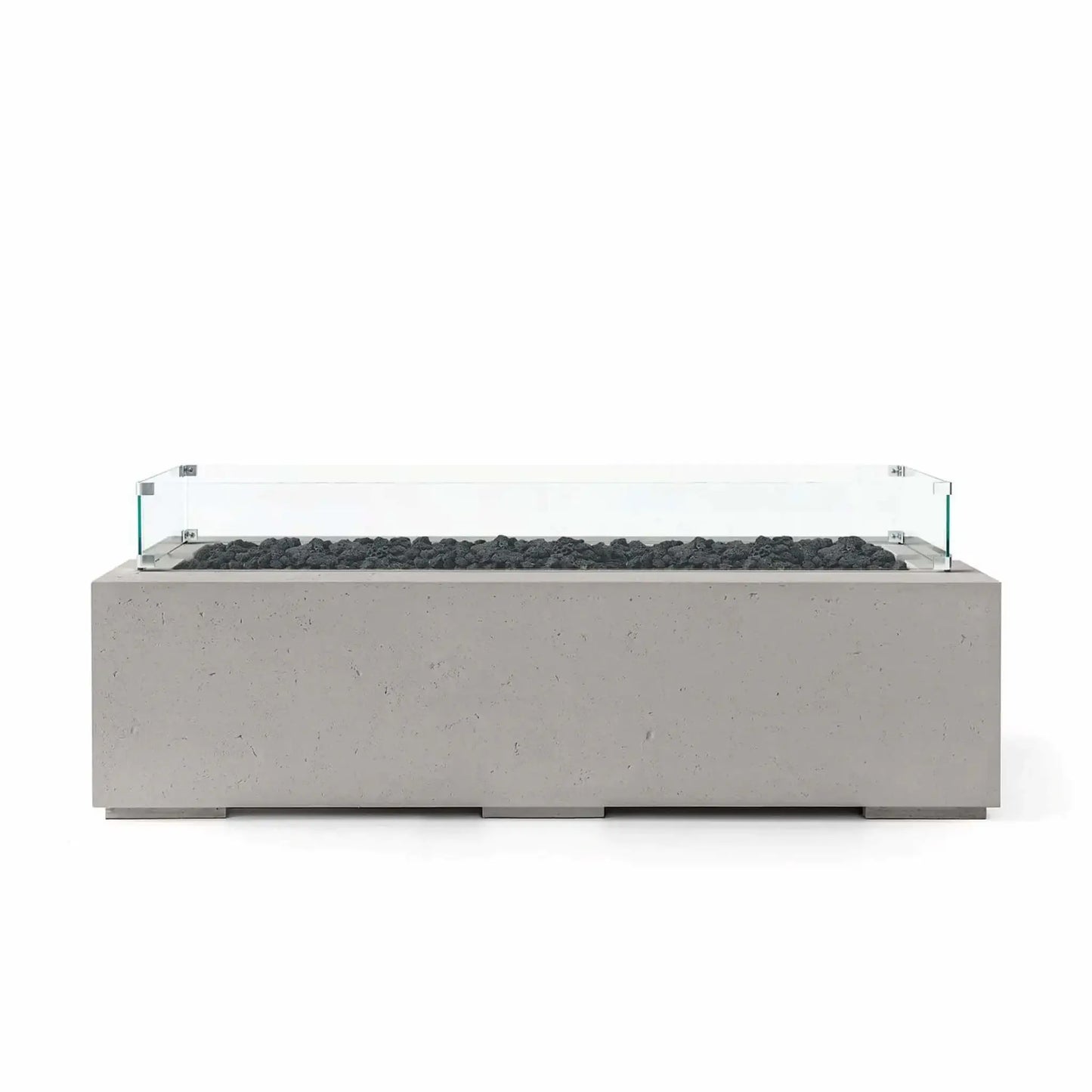 HPC Fire Hearth Products Controls Dekko GFRC Concrete Avera 60 x 26 Fire Pit finished in Sandstone with natural black lava rock media and a tempered glass wind guard. This modern rectangular outdoor fire pit showcases textured GFRC concrete, a long linear burner opening, and sophisticated contemporary styling ideal for entertaining spaces, patios, and backyard lounge areas.