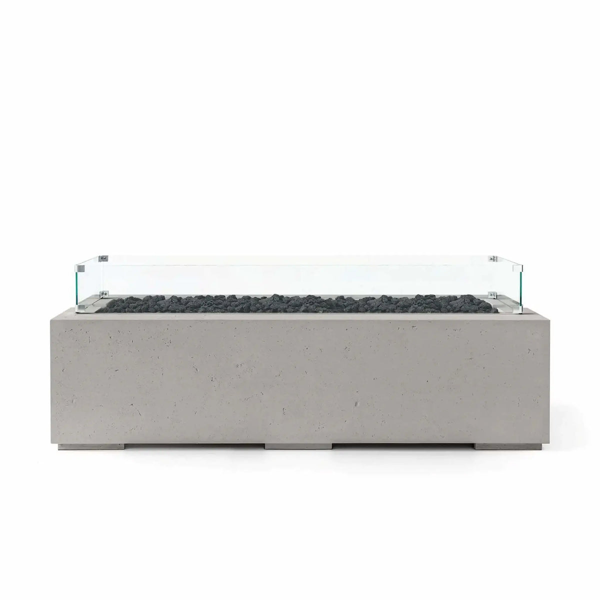HPC Fire Hearth Products Controls Dekko GFRC Concrete Avera 60 x 26 Fire Pit finished in Sandstone with natural black lava rock media and a tempered glass wind guard. This modern rectangular outdoor fire pit showcases textured GFRC concrete, a long linear burner opening, and sophisticated contemporary styling ideal for entertaining spaces, patios, and backyard lounge areas.