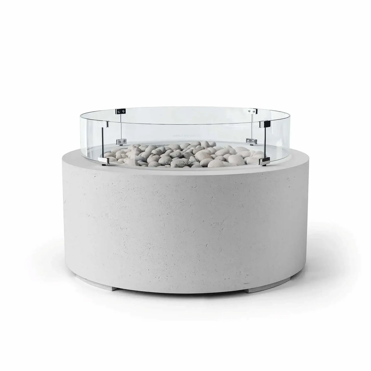 HPC Fire Hearth Products Controls Dekko GFRC Concrete Belmont Fire Pit in Ash finish featuring Ivory Stone media and a round Tempered Glass Wind Guard. The modern fire pit showcases a light gray concrete cylinder base, decorative ivory fire stones, and a clear glass windscreen secured with metal brackets. Displayed on a white background, this Belmont Fire Pit combines contemporary outdoor design, wind protection, and durable GFRC concrete construction.