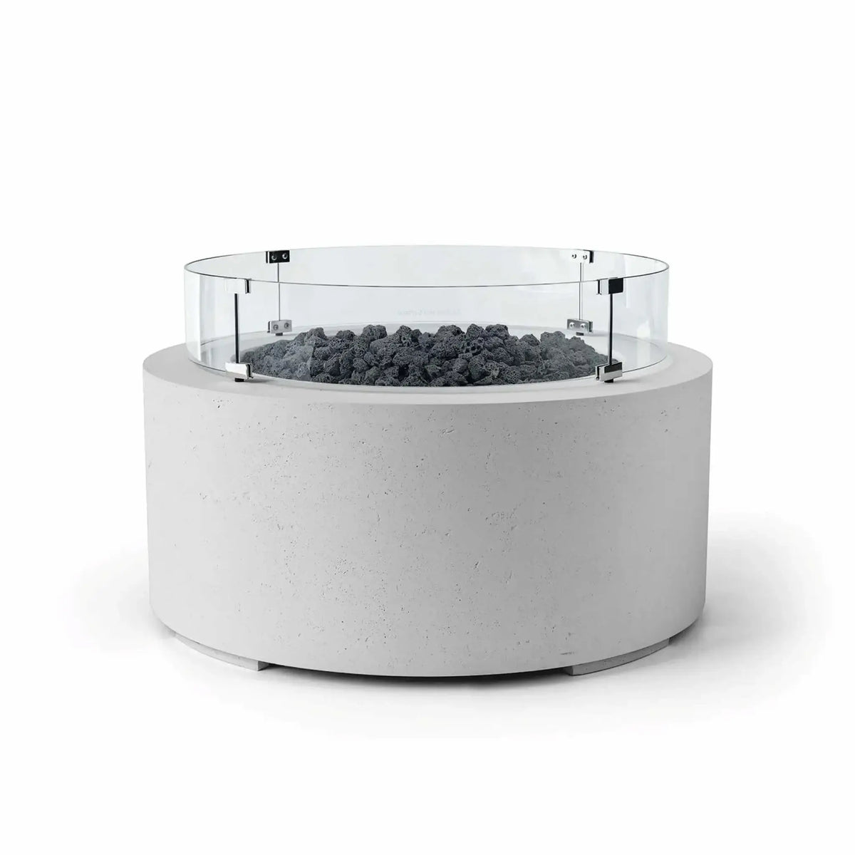 HPC Fire Hearth Products Controls Dekko GFRC Concrete Belmont Fire Pit in Ash finish with Lava Rock media and a Tempered Glass Wind Guard. This round outdoor fire pit features a smooth light gray GFRC concrete body, natural black lava rock fire media, and a circular clear glass windscreen mounted above the burner area. The clean white background highlights the Belmont Fire Pit’s modern aesthetic and functional wind protection.