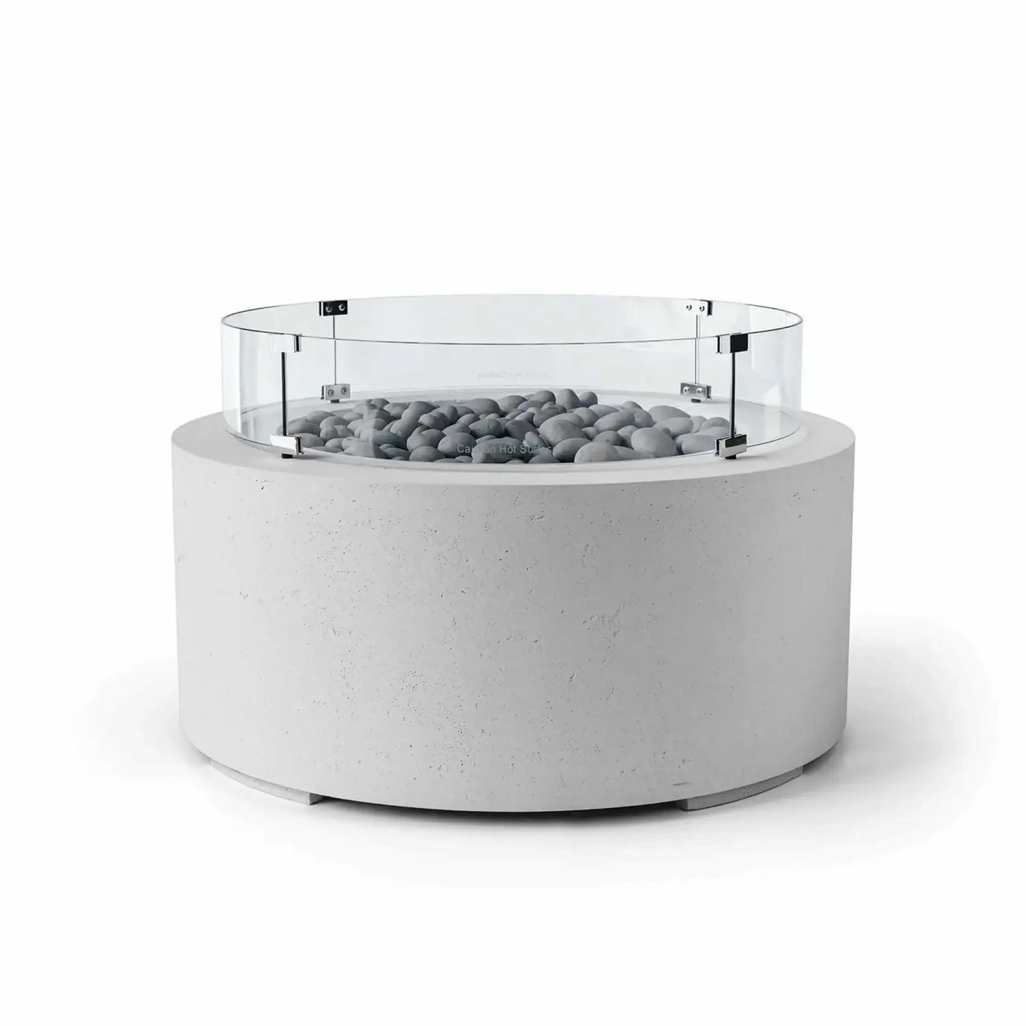 HPC Fire Hearth Products Controls Dekko GFRC Concrete Belmont Fire Pit in Ash finish with Slate Stone fire media and a Tempered Glass Wind Guard. The contemporary round fire pit features a light gray concrete exterior, polished gray slate stones surrounding the burner area, and a transparent circular wind guard supported by stainless steel hardware. Ideal for upscale patios, this Belmont Fire Pit balances style, safety, and performance.