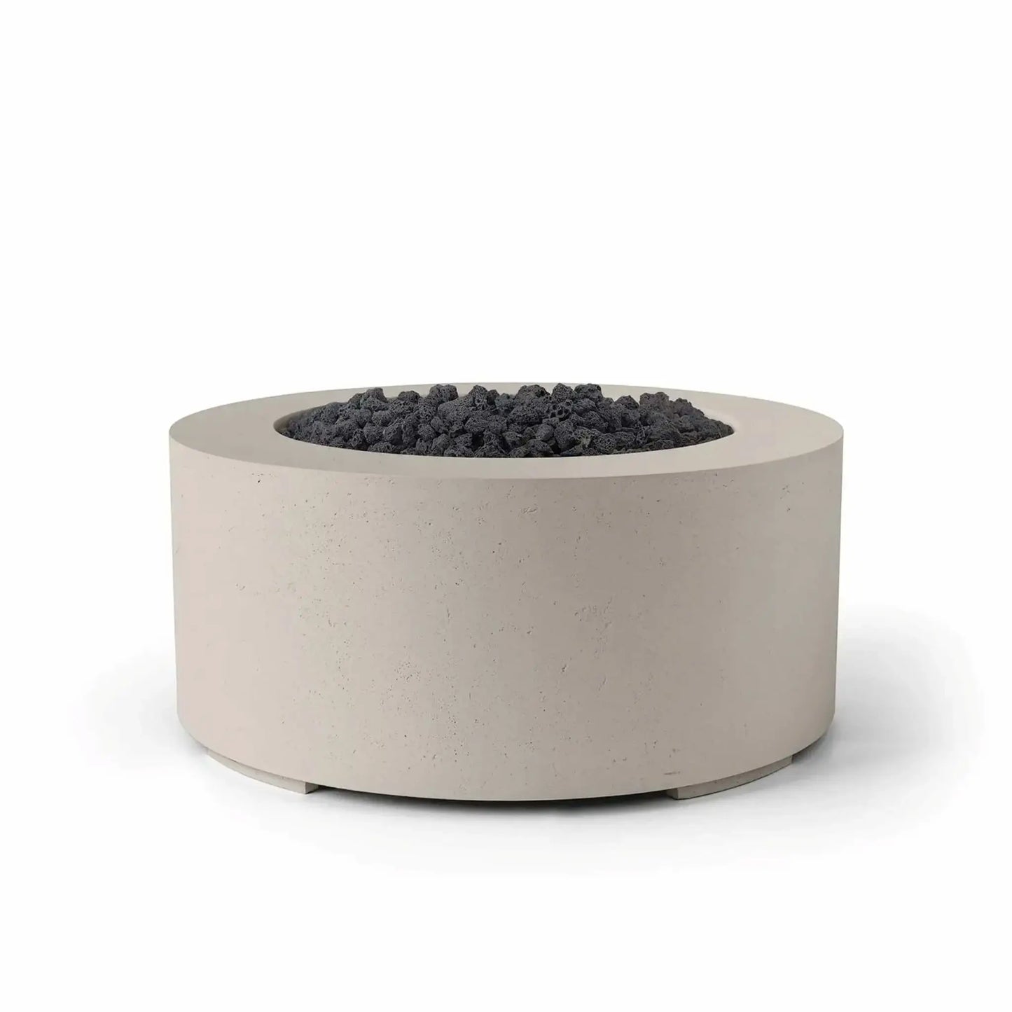 HPC Fire Hearth Products Controls Dekko GFRC Concrete Belmont Fire Pit in Clay finish featuring black lava rock media. The round outdoor gas fire pit combines a warm clay-colored GFRC concrete exterior with rugged dark volcanic rock in the burner area. Its modern low-profile design, textured concrete surface, and clean circular shape create a sophisticated focal point for outdoor entertaining and backyard living spaces.