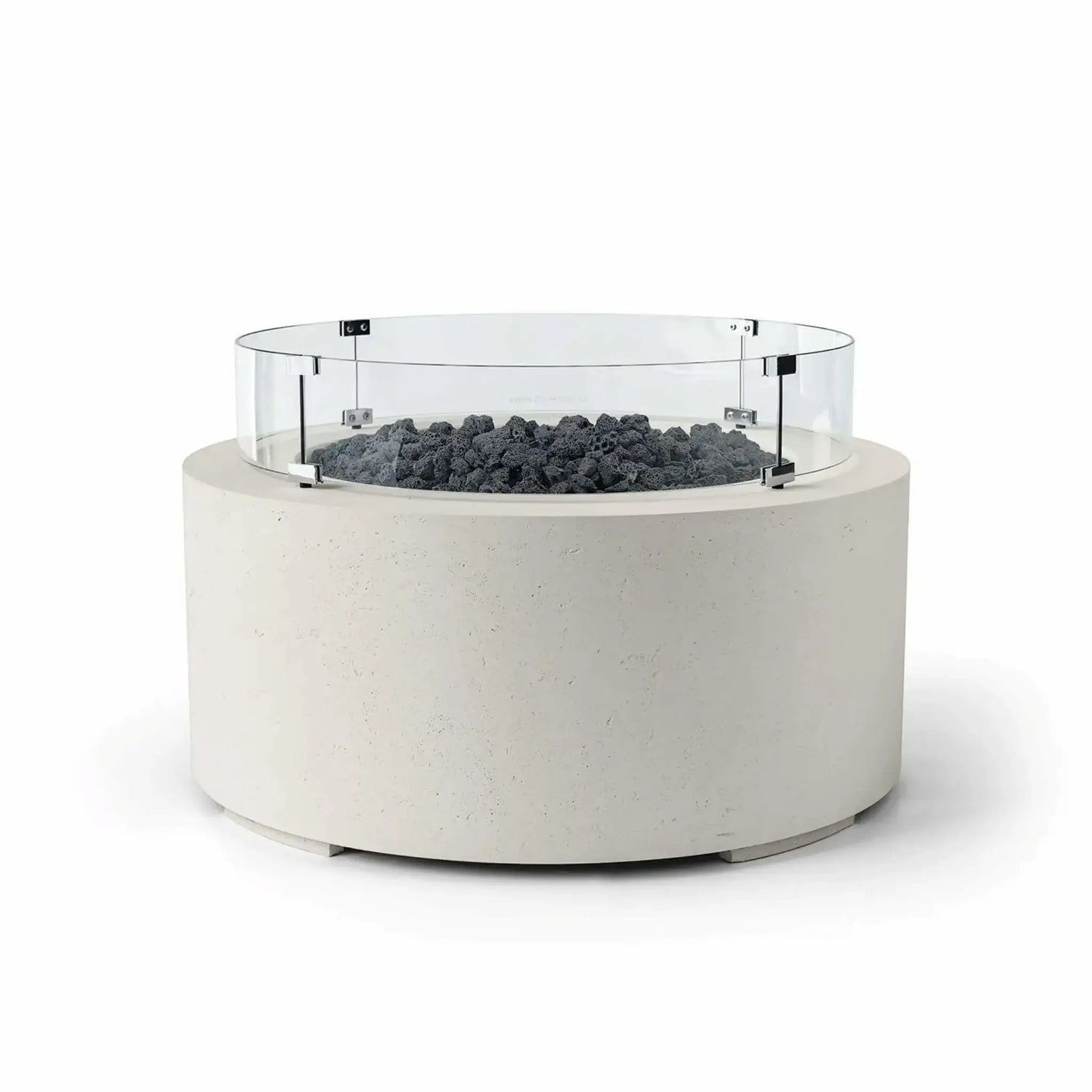 HPC Fire Hearth Products Controls Dekko GFRC Concrete Belmont Fire Pit in Limestone finish with Lava Rock fire media and a Tempered Glass Wind Guard. The round outdoor fire pit features an off-white GFRC concrete base, dark volcanic lava rock surrounding the burner area, and a circular clear glass windscreen secured with stainless steel brackets. Displayed on a clean white background, this Belmont Fire Pit offers a modern, durable centerpiece for upscale patios and outdoor living spaces.