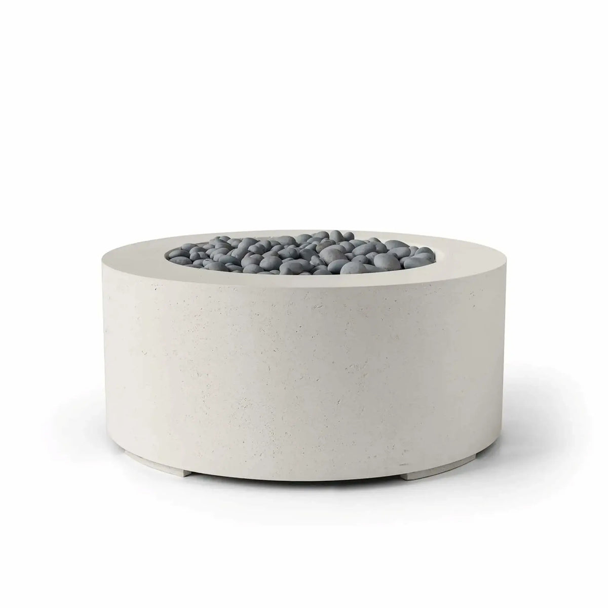 HPC Fire Hearth Products Controls Dekko GFRC Concrete Belmont Fire Pit in Limestone finish showcasing slate stone fire media. This contemporary round fire pit features durable GFRC concrete construction, a smooth recessed burner opening, and decorative gray slate stones. The neutral limestone finish and clean architectural form create a sophisticated outdoor centerpiece suited for modern patios, courtyards, hospitality spaces, and luxury outdoor living areas.
