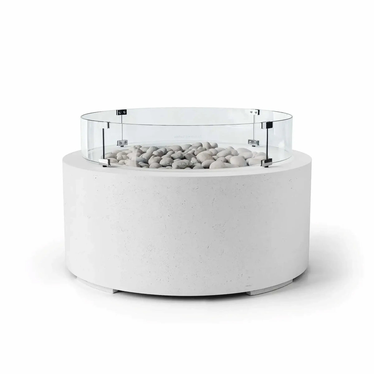 HPC Fire Hearth Products Controls Dekko GFRC Concrete Belmont Fire Pit in Natural finish with Ivory Stone fire media and a Tempered Glass Wind Guard. The fire pit features a bright white GFRC concrete cylindrical base, decorative ivory stones filling the burner area, and a clear round glass windscreen attached with stainless steel brackets. Shown on a white background, this Belmont Fire Pit delivers a clean architectural look for luxury outdoor spaces.