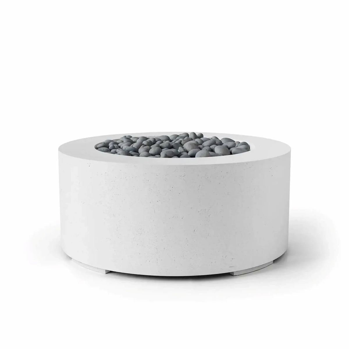 HPC Fire Hearth Products Controls Dekko GFRC Concrete Belmont Fire Pit in Natural finish showcasing decorative slate stone media. This round GFRC concrete fire pit features a soft white concrete appearance, wide top ledge, and recessed fire bowl filled with smooth gray slate stones. The Belmont Fire Pit’s clean lines and modern architectural form make it an elegant addition to contemporary patios, courtyards, hospitality environments, and outdoor entertainment areas.