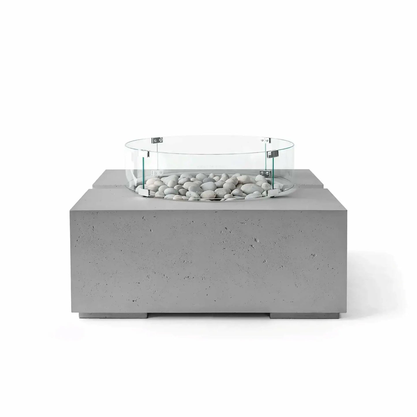HPC Fire Hearth Products Controls Dekko GFRC Concrete Bravo 32 x 32 Fire Pit in Charcoal finish with Ivory Stone fire media and a tempered glass wind guard. The dark gray textured concrete body contrasts beautifully with the light decorative stones, highlighting the fire pit’s modern geometric design and premium outdoor living appeal in a studio-style product image.