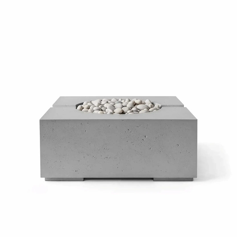 HPC Fire Hearth Products Controls Dekko GFRC Concrete Bravo 32 x 32 Fire Pit in Charcoal finish with Ivory Stone fire media. This low-profile square outdoor fire pit features durable glass fiber reinforced concrete construction, subtle texture details, a recessed circular burner opening, and a modern charcoal-gray finish suited for upscale patio and landscape designs.