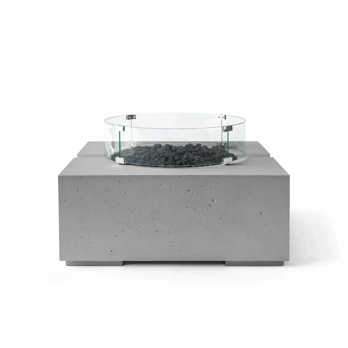 HPC Fire Hearth Products Controls Dekko GFRC Concrete Bravo 32 x 32 Fire Pit in Charcoal finish featuring black lava rock fire media and a clear tempered glass wind guard. This contemporary square outdoor fire pit combines rugged textured GFRC concrete with natural volcanic rock for a bold, modern aesthetic, displayed against a clean white background.
