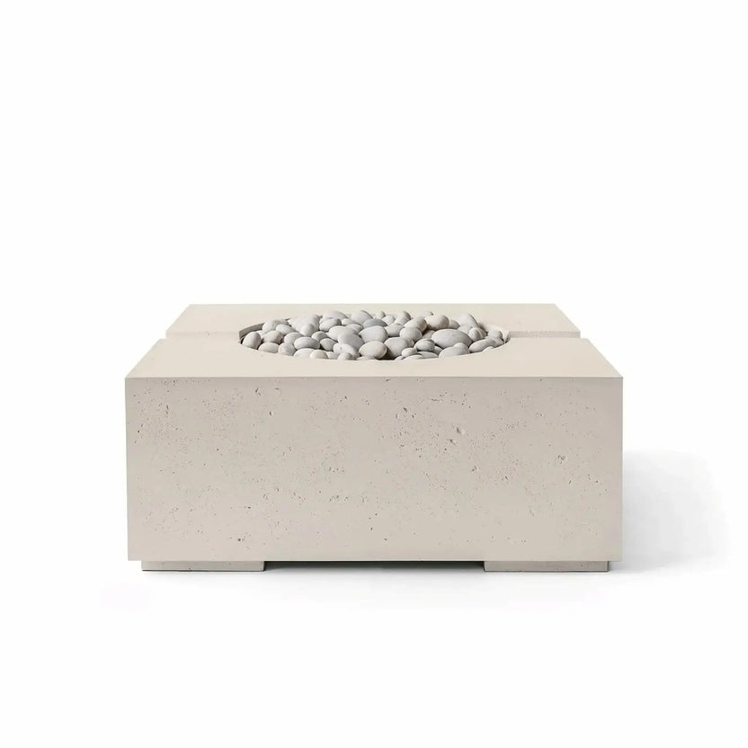 HPC Fire Hearth Products Controls Dekko GFRC Concrete Bravo 32 x 32 Fire Pit in Clay finish featuring smooth Ivory Stone media within the recessed burner area. The warm neutral concrete tone, square profile, and durable GFRC construction create a refined outdoor fire pit that complements transitional and contemporary patio environments.