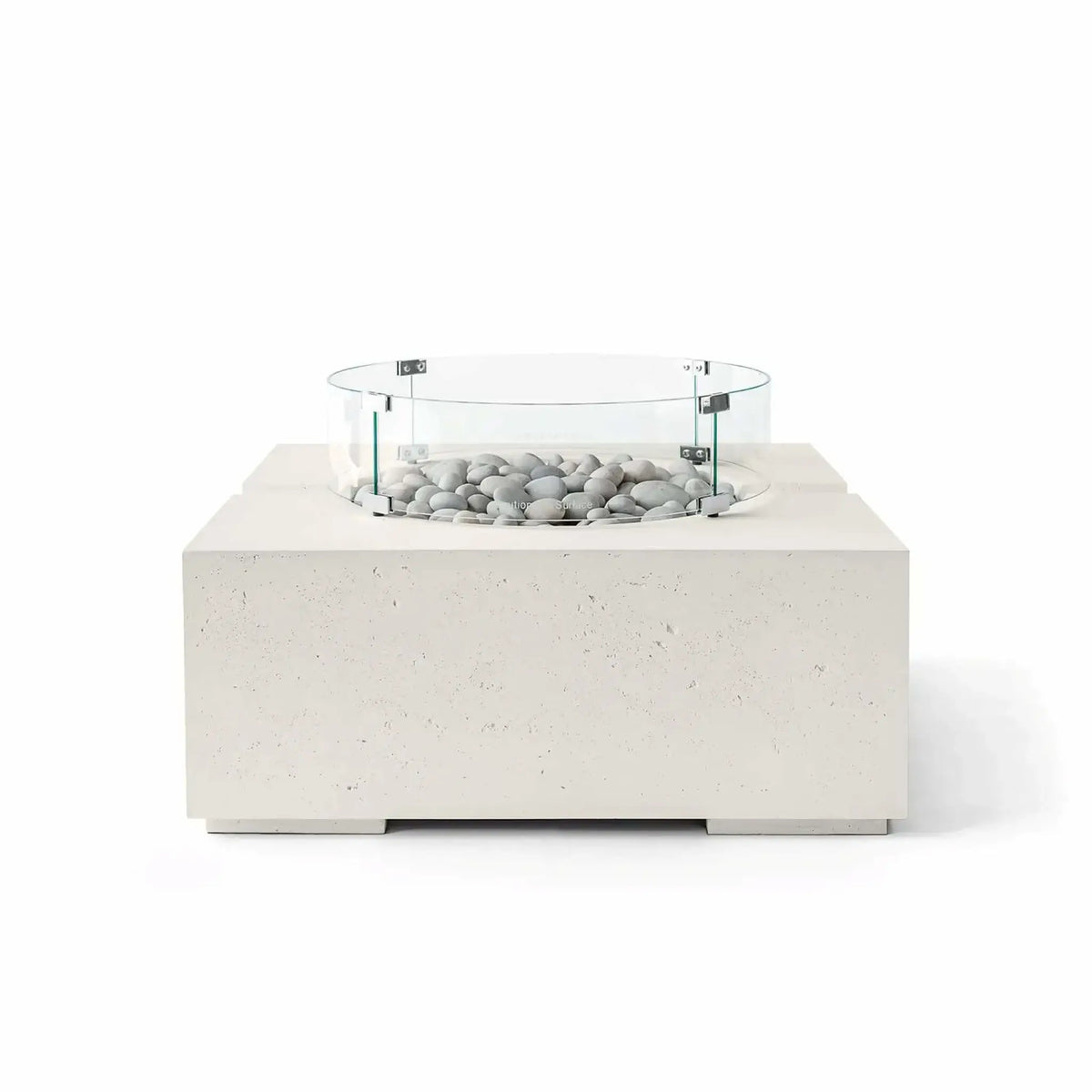 HPC Fire Hearth Products Controls Dekko GFRC Concrete Bravo 32 x 32 Fire Pit in Limestone finish with Ivory Stone fire media and a clear tempered glass wind guard. The light cream-colored GFRC concrete base, smooth decorative stones, and circular glass guard create a sophisticated contemporary outdoor fire feature with a clean architectural appearance and premium craftsmanship.