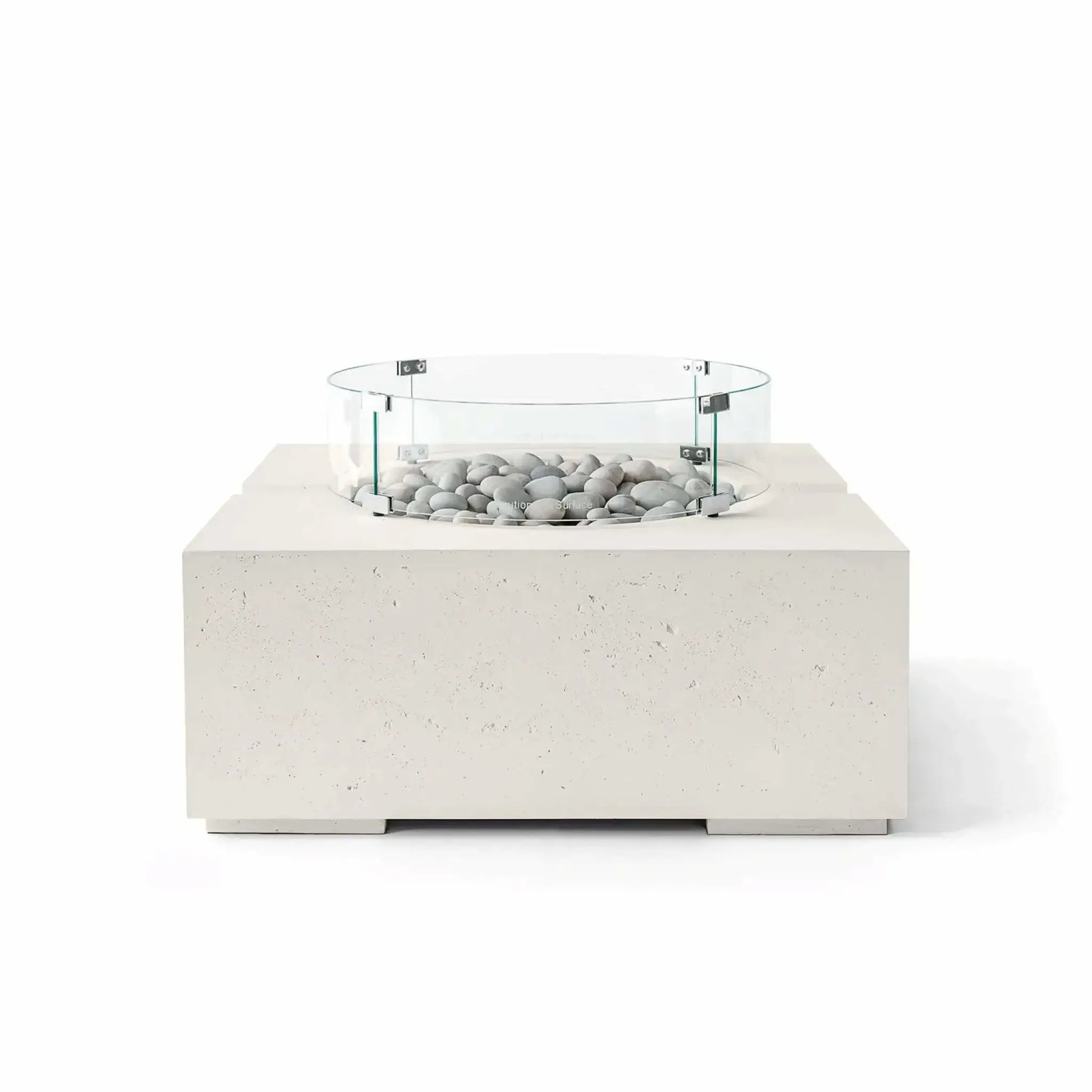 HPC Fire Hearth Products Controls Dekko GFRC Concrete Bravo 32 x 32 Fire Pit in Limestone finish with Ivory Stone fire media and a clear tempered glass wind guard. The light cream-colored GFRC concrete base, smooth decorative stones, and circular glass guard create a sophisticated contemporary outdoor fire feature with a clean architectural appearance and premium craftsmanship.