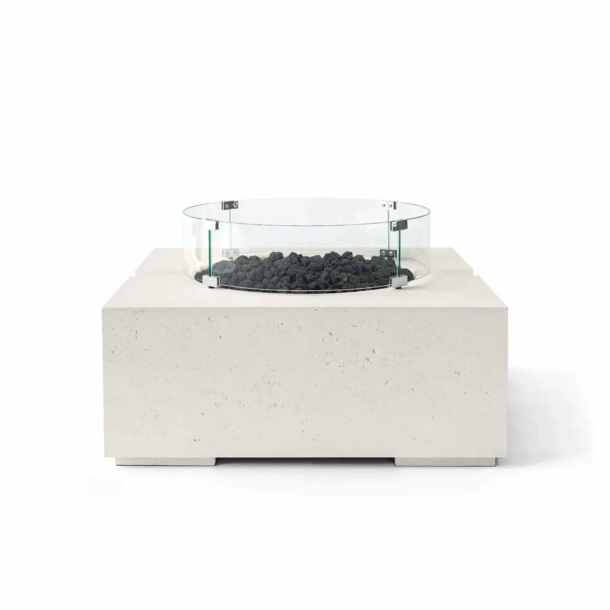 HPC Fire Hearth Products Controls Dekko GFRC Concrete Bravo 32 x 32 Fire Pit in Limestone finish featuring black lava rock fire media and a clear tempered glass wind guard. The light cream-toned GFRC concrete base contrasts with the rugged volcanic rock, creating a modern outdoor fire feature with clean architectural lines, textured detailing, and a raised burner platform, shown in a front-facing studio product image.