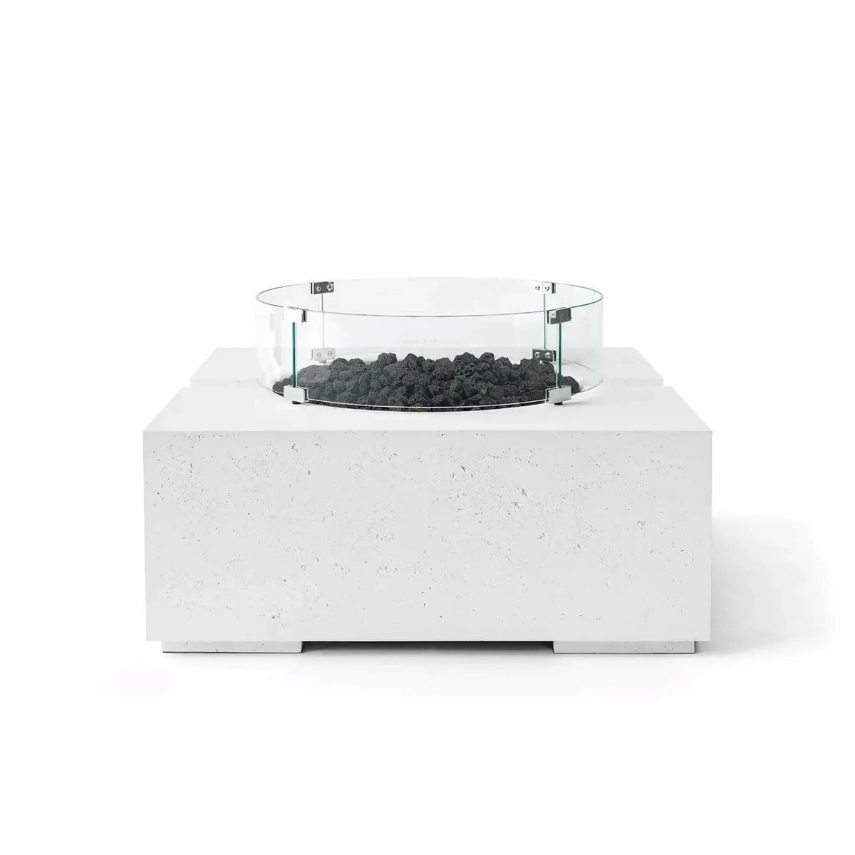 HPC Fire Hearth Products Controls Dekko GFRC Concrete Bravo 32 x 32 Fire Pit in Natural finish with black lava rock fire media and a tempered glass wind guard. The bright GFRC concrete construction contrasts sharply with the dark volcanic rock, emphasizing the fire pit’s modern square profile, textured surface, and clean outdoor living design.
