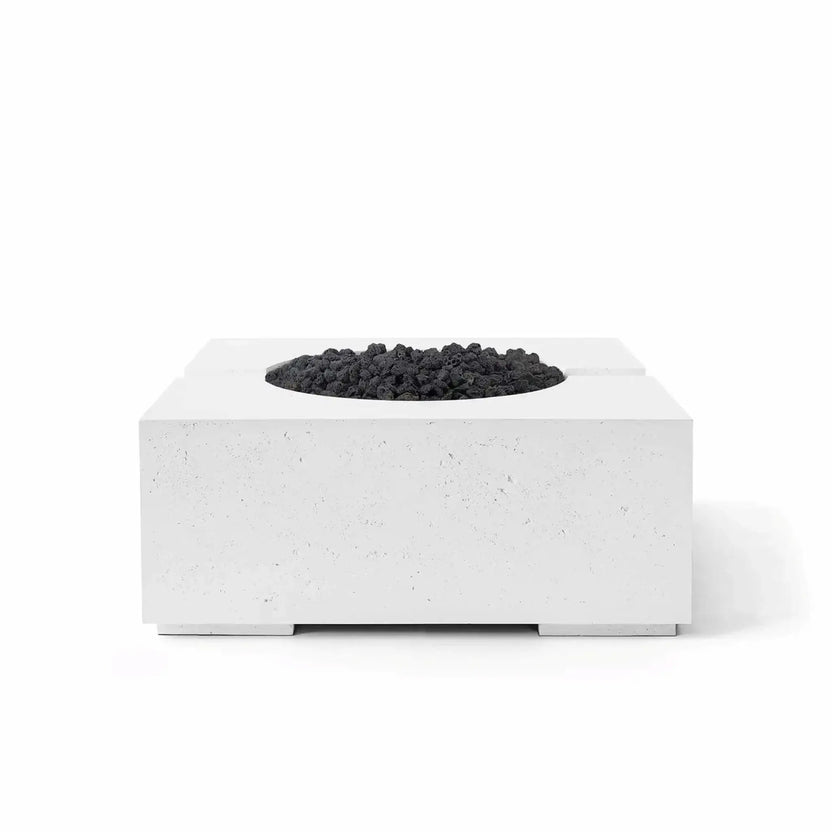 HPC Fire Hearth Products Controls Dekko GFRC Concrete Bravo 32 x 32 Fire Pit shown in Natural finish with black Lava Rock media. This modern square GFRC concrete fire pit combines a minimalist architectural profile, textured concrete surface, elevated base supports, and contrasting volcanic rock fire media, making it an attractive centerpiece for contemporary backyard and patio environments.