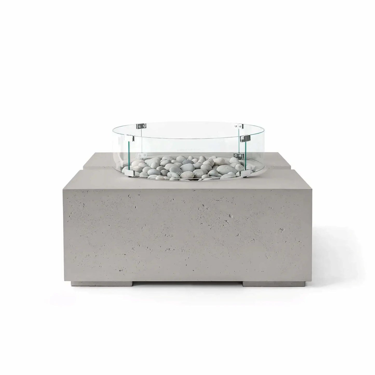 HPC Fire Hearth Products Controls Dekko GFRC Concrete Bravo 32 x 32 Fire Pit in Sandstone finish with Ivory Stone fire media and a clear tempered glass wind guard. The warm beige concrete texture pairs naturally with the light decorative stones, creating an inviting outdoor fire feature with a contemporary square design and premium architectural styling.